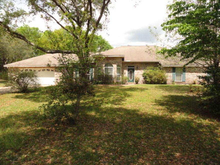 Gated Custom Executive Home on private 10 + acres equipped with a security system and surveillance monitoring in place. Easy access to Interstate 10 and just a few minutes to Crestview shopping. All brick home has steel framing. The open floor plan is perfect for family gatherings and entertaining guest. The kitchen is equipped with Jenn Aire gas range. A island work center and a breakfast bar that seats 4-5 guest. The walk in pantry at the rear of the laundry room is perfect for extra storage. The bedroom layout allows for privacy. The family room, Bedroom/office, and Master suite all have access to the 48 x 13 screened porch. Gas hookup is in place for the grill. The family room has a corner fireplace for those cool nights. The master suite is a generous 22'10 x 19 features a trey