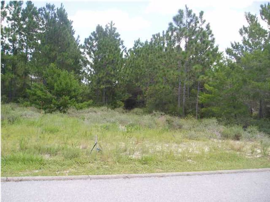 --------------------------------------------------------------------------------Great Price for residential home site in beautiful Wild Heron. Lot is near the acclaimed Shark's Tooth Golf Course and Lake Powell. SOCIAL MEMBERSHIP AT SHARK'S TOOTH GOLF CLUB THAT INCLUDES WATERSOUND BEACH CLUB AVAILABLE. Amenities include secluded living areas with appropriate beautifully maintained landscaping, fully equipped fitness center with Lake Powell view, Prospect Point pool and hot tub, boathouse with canoes/kayaks, boathouse deck with stone fireplace and tables for dining, boardwalk along Lake Powell, fire pit, nature trails and sidewalks. Lake Powell is a treasure and is the largest Coastal Dune Lake in North America. Gated Community with 24/7 security. Wild Heron is enjoying a renewal with man