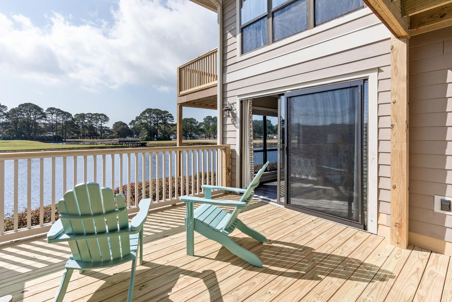 IMPROVED PRICE +INCLUDES A 4-SEATER GOLF CART!!''The Retreat at Turtle Point'' offers spectacular LAKEFRONT and GOLF COURSE views from this adorable, coastal 2 bedroom 2 bath with a coveted FIRST FLOOR location. Enjoy having your own golf cart charging/parking space from DAY ONE (no waiting list)!  Open concept living/dining room and kitchen with access to the deck to take in the view. The kitchen features matching stainless steel appliances, Siltstone counter tops, new flooring throughout  and a large pantry. The spacious master bedroom has sliding glass doors to the oversized deck outfitted with plantation shutters and includes an ensuite bathroom. Enjoy the split bedroom layout, with another spacious second bedroom and bathroom Sandestin Golf and Beach Resort features more than seven miles of beaches and pristine bay front, four championship golf courses, 15 world-class tennis courts, a 226-slip marina, a fitness center, spa and celebrity chef dining. Shop, dine and play at the charming pedestrian village, The Village of Baytowne Wharf and more. Inside the gates of the resort, residents enjoy a balanced lifestyle of high-class living, spanning the 2,400 acres from the beach to the bay. Everything within the gates of the resort is accessible by golf cart or bicycle. The entire resort is interconnected by miles of pedestrian, bike and golf cart paths that weave through groves of live oaks, meandering past natural lagoons, fountains, man-made lakes, and meticulously landscaped fairways.
