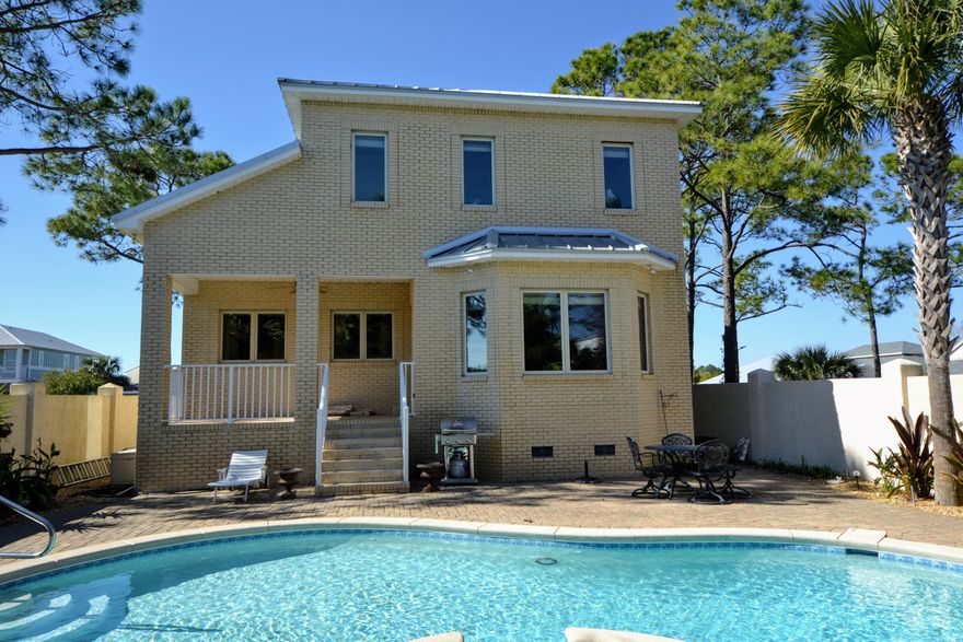 Custom Built Home Located in a Gated Neighborhood on the Popular West end of Panama City Beach, and Just a Short Walk to The White Sands of the
Gulf of Mexico, Close to Shopping, Restaurants, Pier Park and 30A. Upgrades include Granite Counter Tops & Italian Tile in the Kitchen & Bathrooms, Oak Cabinets,
Breakfast Bar, Dining area overlooking the Heated Private Salt Water Pool, Solid Oak Flooring, Large Master Bedroom with Walk-in Closet, Master Bath with Walk-in
Shower and Double Vanity, Stainless Steal Appliances, Rinnai On-Demand Water Heater, Central Vacuum System and a huge 2 Car Garage with Plenty of Storage
and it's own Bathroom. The Walled Back Yard is beautifully Landscaped and there is a cute Maintenance Shed to Store all your Garden tools.