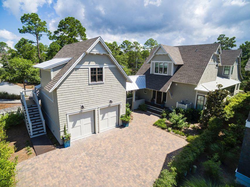 UNDER CONTRACT WITH 72 HOUR KICK OUT.  This gorgeous, one of a kind home, offers the most stunning exterior elevation and interior finishes in Watersound West Beach. In this private gated community you will enjoy access to 30A's premier secluded beaches through Deer Lake State Park. The front entrance to the home is just off the boardwalk to the beach & community pool and fronts a large park with trees for privacy. A spacious screened porch leads through french doors to the beautiful great room that is open to the chef's kitchen featuring a commercial sized Viking range, large marble island, and designer Walker Zanger tiles. Entertaining is a dream as the great room flows into the dining hall which features french doors to yet another spacious screened porch.