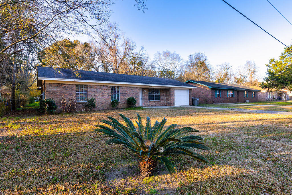 Nestled right off Highway 29, near Tate High School, this adorable home features 3 bedrooms, 2 baths and huge backyard. This clean and well maintained home features tile flooring throughout, a brand new garage door, hot water heater and a fresh, neutral coat of paint, giving the home a bright and airy feel. The master bedroom boasts a brand new, fully tiled shower with built in shelves. Centrally located in a great school district, this one won't last long. Come check it out today!