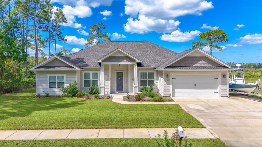 Introducing this stunning custom-built 4-5 bedroom home, proudly situated on a spacious lot in the sought-after Colony Club community. Designed with both style and functionality, this residence features a split bedroom floor plan, an open-concept living and eat-in kitchen area, a separate dining space, and a flexible room that can serve as a 5th bedroom or home office. The master suite includes a luxurious bathroom with a walk-in shower, a garden tub, and a large walk-in closet. With a total of four bedrooms and an office that can easily convert into a fifth, this home is ideal for large or extended families.
Boasting over 2,200 sq. ft. of meticulously maintained living space, this bright and airy home is filled with natural light thanks to its many windows. *SEE ADDITIONAL REMARKS* Outside, you'll find ample parking with an oversized driveway, an additional pad for a boat, jet skis, or an RV, and a double car garage. The home also features 52 solar panels, significantly reducing electricity costs, and includes a transferrable home warranty valid through January 2026. Located in the unique Colony Club community, known for its proximity to Gayle's Trails, Pier Park, and easy beach access, this home provides an exceptional lifestyle. The Legacy Golf Course, a championship course with a clubhouse and bar & grille, is at the east entrance of the neighborhood. Don't miss this rare opportunitycome see it for yourself!