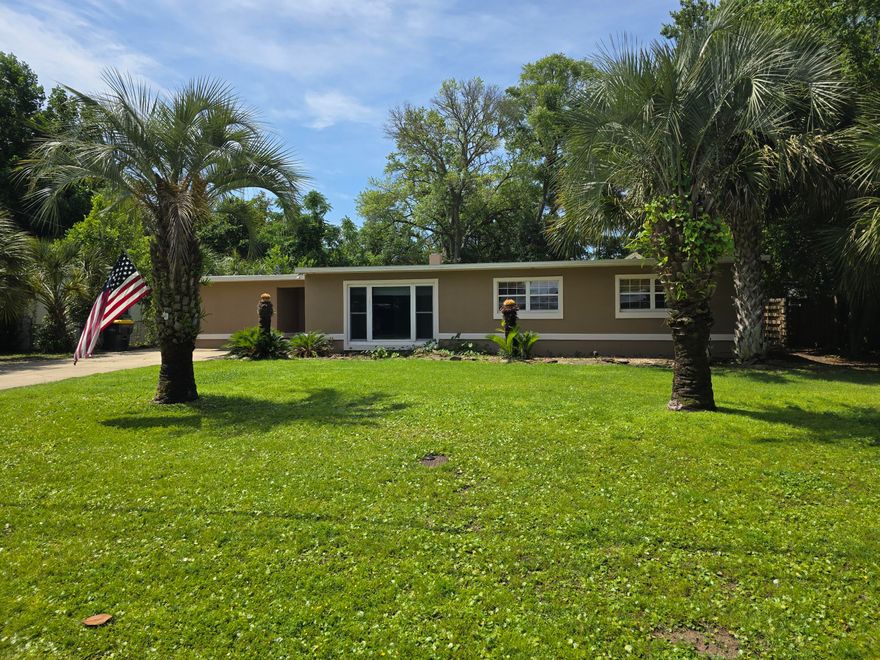 Comfortable and inviting 4-bedroom, 2-bathroom home offering 1,865 sqft, located just half a mile from Ferry Park and near military bases, beaches, shopping, and restaurants. Inside, you'll find vinyl plank flooring in the main living areas and a cozy fireplace with a mahogany surround that adds warmth and charm. The kitchen opens to the dining area and features granite countertops, stainless steel appliances, and plenty of cabinet space--ideal for everyday living or entertaining. The primary bedroom includes two closets for extra storage. Step outside to enjoy a large fenced backyard with a covered patio and storage shed. Roof replaced in 2025. Schedule your showing today and come see what makes this home such a great opportunity!