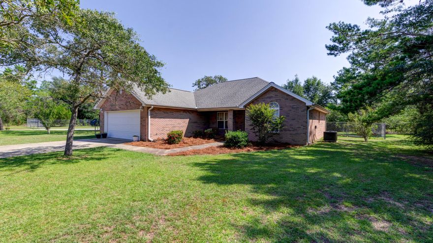 This is a must see 3 Bedroom 2 Bath brick home with a second lot that has a 34x36 workshop. The home features a split-bedroom floor plan, tray ceilings, solid hickory cabinets in the kitchen and baths, a fireplace, two car garage and a detached workshop. The back yard is completely fenced in and the workshop is also fenced in. Sunny Hills is a beautiful golf course community located only 15-20 Minutes from Lynn Haven. The 34x36 workshop has a storage room and a lofted area. Both sides of the workshop has covered parking areas. Listed in ECAR MLS.