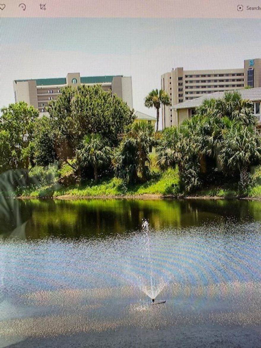 Cute, One bedroom with a Lake view. Expanded over the porch giving the interior more square footage. Some updates. Washer/dryer hook up. Tile, Amenities Include: 3 pools, community room for Owners, grills, bike racks, tennis. Buyer to verify any and all dimensions.