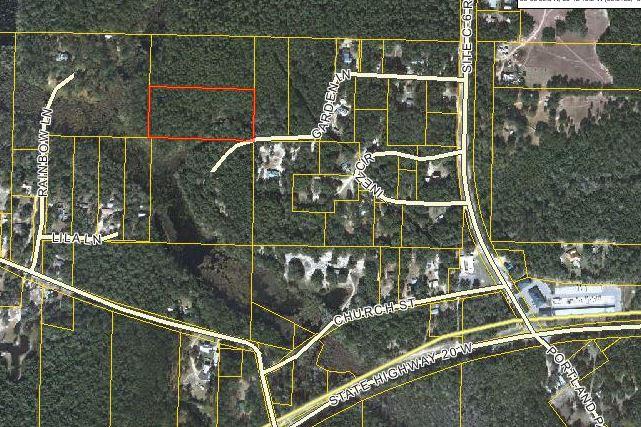 Over 5 acres of beautiful land that abuts a lake to the West. Heavily treed but the Owner has cleared a road and frontage and will clear enough for a home. Just off or Hwy 20 in a very private setting this parcel can be bought alone or the additional 5.1 acres can also be purchased allowing for over 10 full acres of buildable land. A nice country setting bring the whole Family. Owner financing will be considered.
