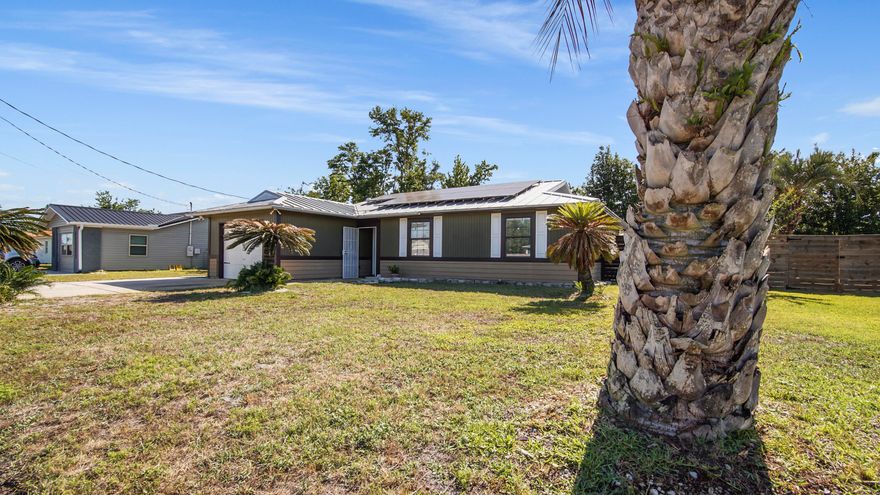 ZERO POWER BILL! This fully remodeled home offers solar panels with battery backup, leaving you with only a $29 monthly connection fee. Located just a quarter mile from Cain Griffin Park and the Lynn Haven Rails to Trails pedestrian walking and biking path, this property is perfectly situated for outdoor enthusiasts. Within a mile, you'll find Walmart, Publix, Aldi, and more, and with Lynn Haven's golf cart-friendly streets, getting around town is a breeze! The open floor plan is ideal for both relaxing and entertaining, with a spacious family room featuring a functional wood-burning fireplace. The kitchen is a chef's dream, showcasing new cabinets, countertops, a stylish backsplash, and brand-new appliances. The master suite provides a luxurious retreat with a walk-in closet and a remodeled bathroom, complete with a massive walk in shower. The guest bedrooms and bathroom are equally updated, offering comfort and style throughout. Step into your private outdoor oasis, where a sparkling pool with a new liner, pump, and filter awaits, surrounded by a high-wind-rated privacy fence. The screened-in porch provides the perfect spot for year-round enjoyment, while the newly constructed 20 x 8 x 12 detached storage building offers endless possibilities, including conversion into a mother-in-law suite. Smart home enthusiasts will love the whole-home automation with Alexa integration, as well as a security system featuring five Alexa-enabled cameras. With its extensive upgrades, energy-efficient solar system, and inviting outdoor spaces, this home is truly one of a kind. Schedule your showing today and make this move-in-ready gem yours! The seller is willing to sell ALL of the furnishings in the house on a separate contract for 10k.