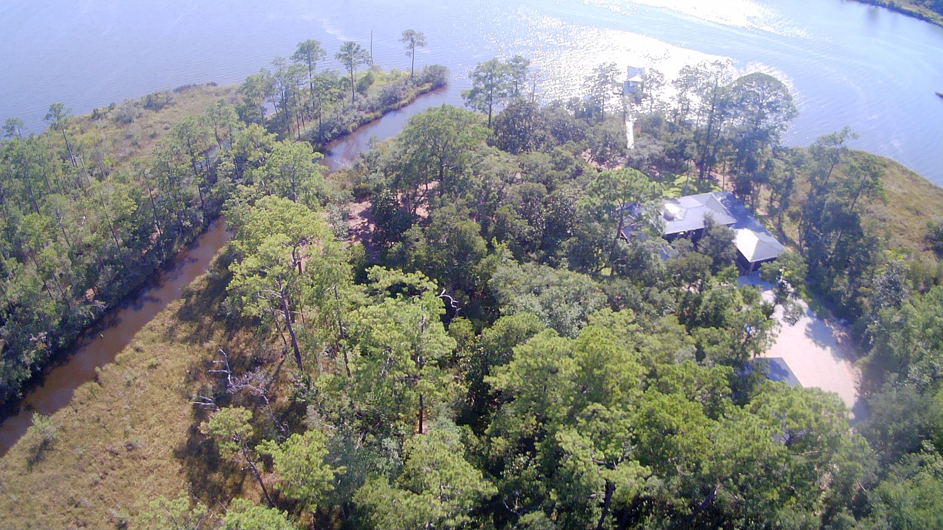 6 Beautiful lots totaling just over 2.9 Acres. Build your dream home, shop, or vacation retreat! Property has a canal on the southwest corner opening up to LaGrange Bayou which connects to the Choctawhatchee Bay. Walk the property to take in it's full beauty and let your imagination run wild. Just a mile from Freeport shopping and a 12 mile drive to the gorgeous sandy beaches of South Walton. Survey available upon request.