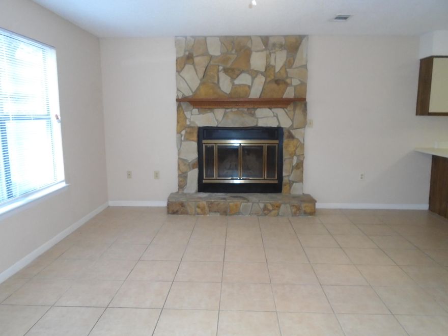 Spacious townhouse with ceramic tile, and carpet! End unit has nice size fenced yard and storage shed. Cozy fireplace for cool winter nights; 2nd flr bedroom has private balcony and each bedroom has it's own bathroom. Inside laundry room. Medium sized dog allowed with non-ref pet fee. Absolutely no cats! Available Now.