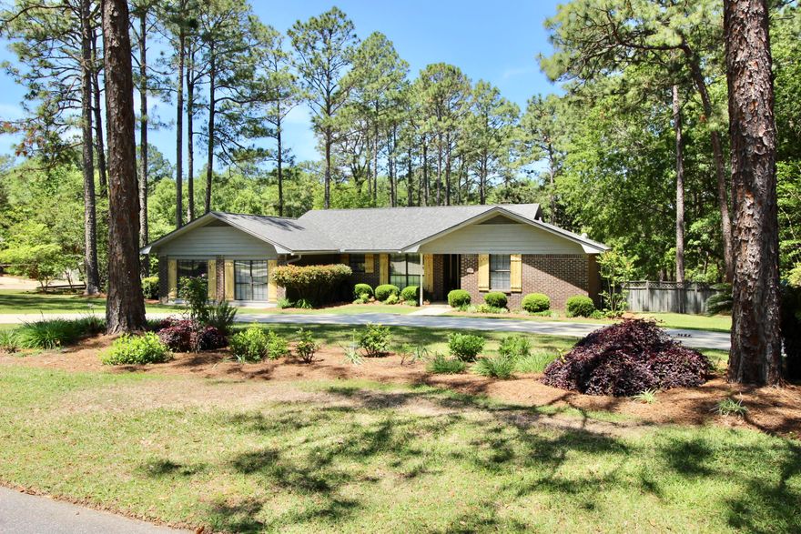 Picture of perfection! Thoroughly updated, this Pine Shores home is nothing short of enchanting, inside and out. The back yard could be straight out of Southern Living! Classic white kitchen cabinets and granite countertops with breakfast area. Gorgeous Australian cypress floors in most of the home, including bedrooms. Split floorplan with roomy master suite & views of gorgeous back deck, pool & yard. French doors lead to an open & airy master bath, offering a huge walk-in tile shower. Oversized den off of the large utility room w/ laundry sink. The crown jewel awaits you outdoors... Salt water gunite pool with tanning ledge & generous deck for sunbathing. Sit under the pergola overflowing with jasmine... Home warranty w/ full price offer! Pre-inspection results available upon request.
