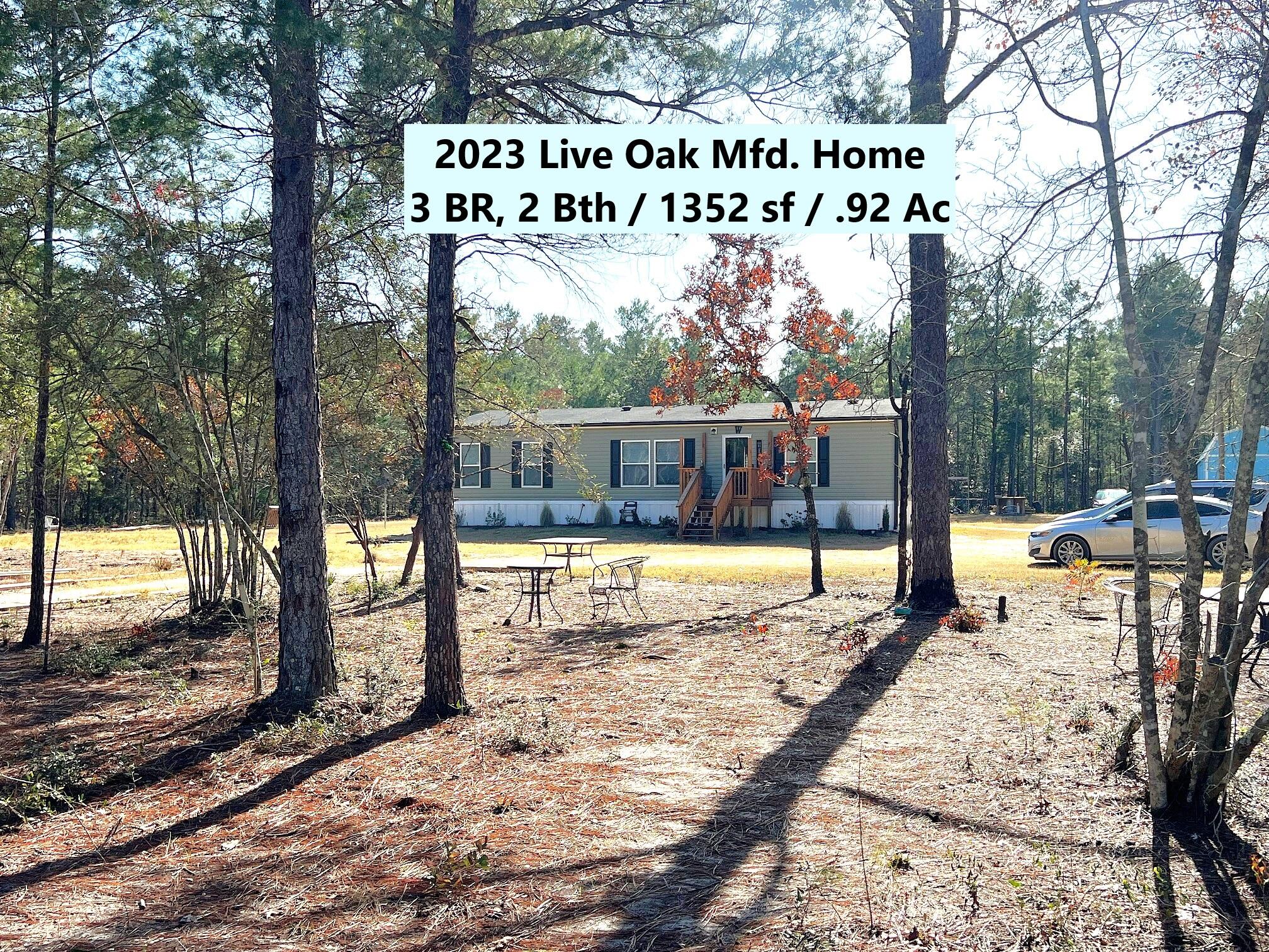 This is a definite must see! 2023 3 BR, 2 bath, 1352 sf Live Oak manufactured home on .92 acres. If you're looking for privacy, but still want to be close to town, this beautiful & immaculately maintained home is nestled away from the main road & is w/in 15 min. to Defuniak Springs & 10 min. to I-10 in Mossy Head for a quick commute to Crestview, Niceville, FWB airport and Eglin AFB. Interior features include kitchen island; split bedrooms, open floor plan; double vanities, oversized tub & separate shower in master bath. Exterior features: Chicken pen, dog kennel, small storage building. Just sit on your front porch & enjoy the serenity this location provides. You'll also enjoy your own private well & septic to keep those utility bills down. Don't miss this opportunity...schedule today!!