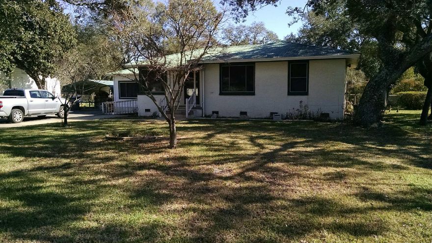 This 4 bedroom home sits on a very large corner lot with mature trees. Large family room as well as a formal living room or dining room your choice. Some upgrades have been made to the eat in kitchen and baths. Home is sold as is and the stove and fridge are not included in the sale. Seller states there are hardwood floors in the original part of the house in three bedrooms, hallway and front room. Seller is offering a $5,000 allowance towards closing cost and or appliances.
Over sized parking with two car carport. Home has a metal roof and double insulated windows. Convenient location.