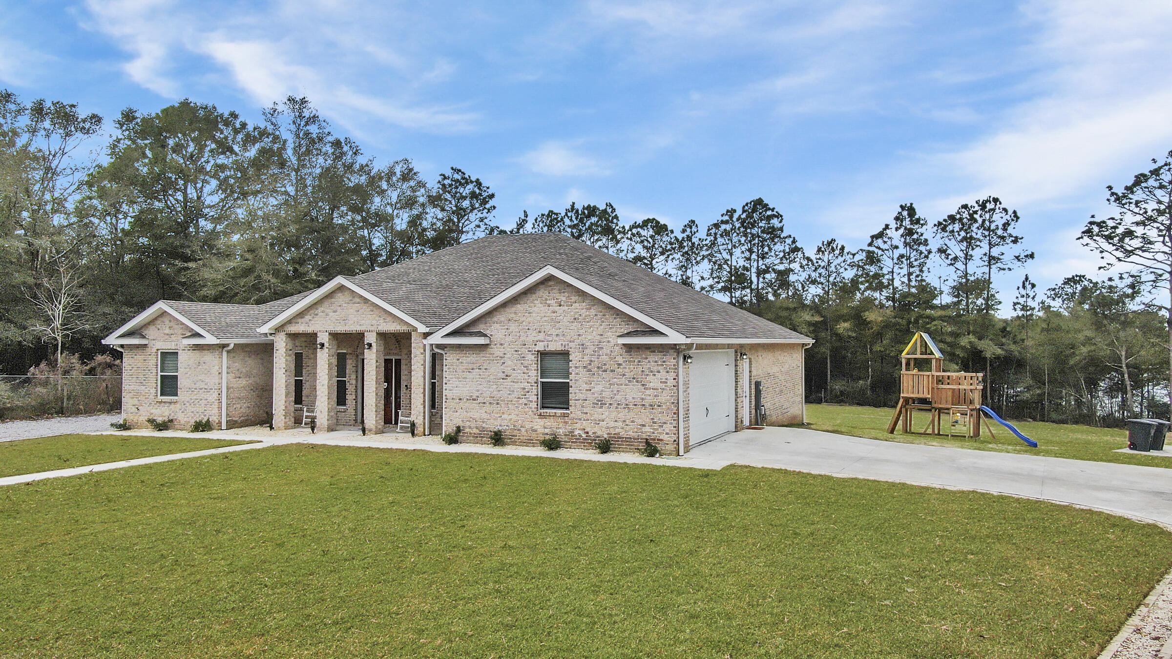Incredible opportunity to purchase one amazing brick waterfront home on 1+ acre - or TWO homes side by side (plus a 3rd fully finished apartment - see MLS 890649)! First, let's look at the main event - a nearly new, 2019 contractor built and owned home, with the most updated farmhouse style and charm you'd expect. Upon entry, the foyer is styled with a barrel vault pine tongue and groove ceiling, with sconce lighting and columns, perfectly planned to display art or precious family photos. Next, opening up to the great room, you'll find tons of light from the windows framing the water view, with more tongue and groove ceilings, this time vaulted. Each space is generously sized for comfort. From the well appointed kitchen with raised breakfast bar, gas range, the newest in stainless steel