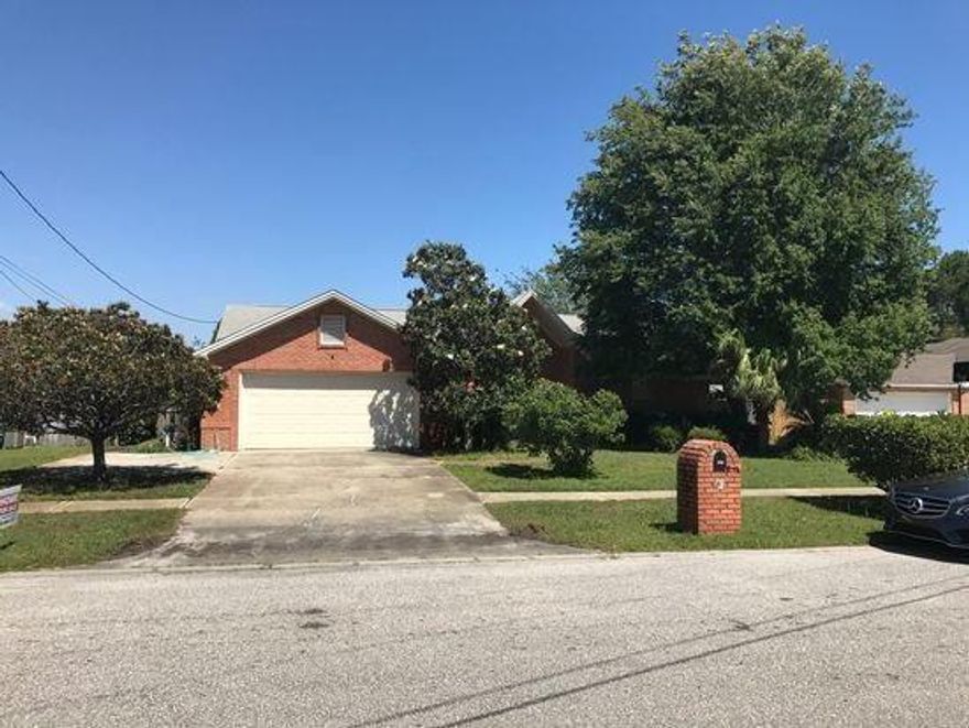 This stylish brick home is conveniently located on a quiet culdesac near Hurlburt Field, Navarre Beach, schools and shopping. The house is well landscaped with mature trees and a lush yard with sprinkler system. The rear yard is fully fenced and has an expansive deck off the living room spacious dine in kitchen. The step down living room features a vaulted ceiling and rustic brick fireplace. The air conditioning system and water heater have been recently replaced. The home is priced to sell and has been deep cleaned and vacated as the owner has moved to another state.