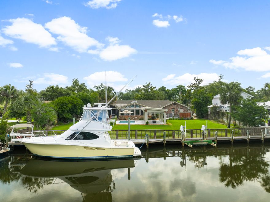 Tucked at the end of a quiet street in Baywood Shore Estates, this canal-front retreat offers the best of Northshore living: a private backyard oasis, deep water access, and no HOA restrictions. With 111 feet of canal frontage, a seawall, and a dock already in place, it's a boater's dream--offering seamless access to the bay, Intracoastal Waterway, and the Gulf beyond.Inside, this thoughtfully upgraded single-story brick home spans over 3,200 square feet, delivering comfort and functionality at every turn. The spacious living room, anchored by a wall of windows and a built-in 60-inch TV, opens to the screened porch and pool area, providing serene water views and effortless indoor-outdoor flow. At the heart of the home, the chef's kitchen features a commercial-grade 60" FiveStar double oven range with grill, double refrigerators, and a built-in Hoshizaki undercounter ice machineideal for entertaining. The adjacent dining room offers plenty of space for gatherings large and small.

Three bedrooms and two baths include a generous primary suite with a custom walk-in closet, spa-style bath, and steam shower. Additional highlights include a dedicated home office, game room, a temperature-controlled tackle room, and custom blinds throughout. A whole-home water treatment system ensures quality and comfort at every faucet.

Outdoors, the concrete pool, pergola, and fire pit create a stunning focal point, while the summer kitchenfeaturing a Blaze grill and Primo smokersets the stage for unforgettable alfresco dining. The home is equipped with hurricane-rated windows and doors, a whole-home generator, and an owned 500-gallon propane tank (not leased). The new roof, installed in May 2025, includes a 50-year transferable warranty.

Whether you're cruising the bay, cooking for a crowd, or enjoying a quiet sunset from your private dock, this meticulously maintained residence captures the essence of laid-back coastal living. For those seeking the complete waterfront lifestyle, a 39-foot Tiara Yacht is available through a separate bill of sale.
