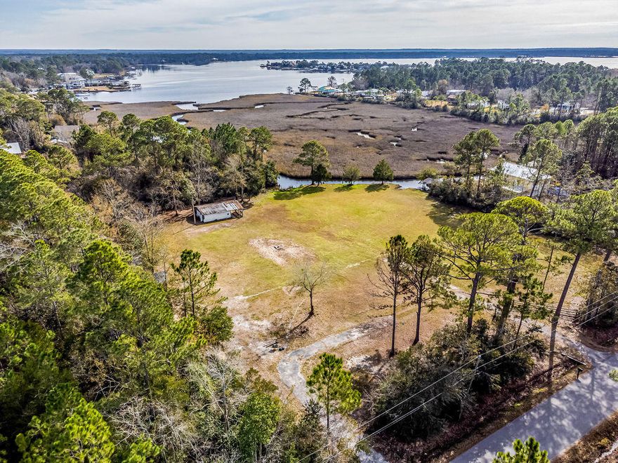 Come build your dream house on this waterfront parcel offering 2.30 acres located just half a mile from I-10. This cleared lot offers 70 feet of waterfront footage and 2 storage buildings (24x24) and (11x10). With no HOA you have plenty of room to store all your toys. Zoned low density residential so multiple homes can be built on this property as well as horses allowed. (1 horse per acre). Water tap fee has been paid and there is a septic tank. Boat house in place and ready to go! This Bayou leads to the Ward Basin which heads out to the Blackwater River. Located lass than 5 miles to historic downtown Milton and the river walk. Such a great location! Check out our full video tour on the MLS and YouTube.