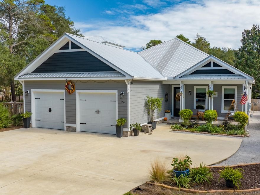NO HOA! Deeded Beach Access - Room for Pool - Spacious Lot. This 2018 custom-built, single-level home offers 3 bedrooms, 3 baths, a first-floor den, and approximately 300 square feet of flexible second-floor space that could be finished as an office, bath, or whatever you envision. Set on a large lot with ample room for a pool, the property also provides a two-car garage plus open parking for more than ten vehicles. A generous 16x26 screened porch invites you to relax and unwind, while the secluded deeded beach access on South Bishop Road is just four blocks away. The home is also conveniently located near Topsail Hill Preserve State Park. Inside, the open living space is accented by a striking wooden beam and encompasses a welcoming living area with a stone-inlay gas fireplace, wet bar, large dining area, and gourmet kitchen. The chef's kitchen is a true highlight, featuring a top-of-the-line gas range, spacious island, and walk-in pantry. Ten-foot ceilings, porcelain plank tile flooring, solid-core and barn doors, crown molding, and custom blackout shades all contribute to the home's sense of elegance and comfort. From the main living area, you can step out to the screened porch to enjoy the 13-foot swim spa and a summer kitchen with grill and burner an outdoor retreat that any chef would dream of. Buyers will also appreciate the stairs leading to the fully foam-insulated attic, providing additional storage or work space. Beach lovers will enjoy the proximity to a secluded access point near Topsail Park, with opportunities for biking through the park or along scenic 30A. Situated on the west side of 30A in a quaint, tree-lined neighborhood, this property has no HOA fees and rests in a low-risk X flood zone. Additional features include a whole-house water filter, while negotiable items such as an infrared sauna, garage freezer and fridge, washer and dryer, furnishings, and free-standing appliances offer added value and convenience.