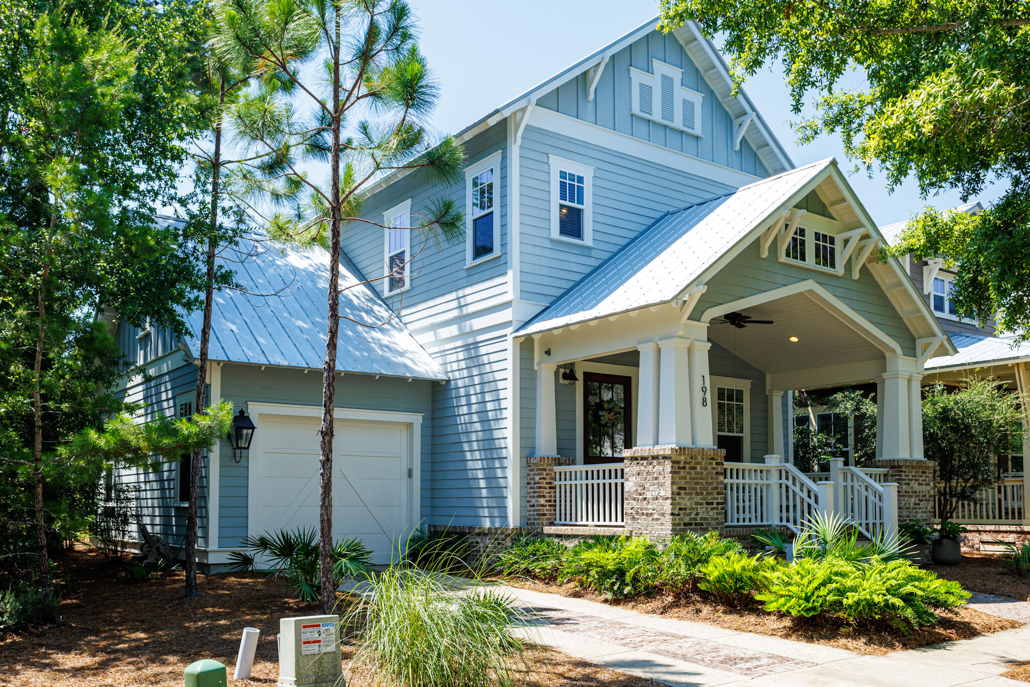 Welcome home!!! This neighborhood is ''Old Florida'' at its best. Forest Lakes is the best kept secret on 30A. This award winning David Weekley house is nestled in this quaint community with Florida's natural vegetation,  and a beautiful coastal lake. This community offers fishing, paddle boarding, kayaking, natural playground area, and hiking trails to enjoy the natural habitat. For those hot summer days, enjoy a summer swim in the  two-tiered pool and then enjoy a summer picnic under the covered pavilion. The pavilion offers a summer kitchen and a fireplace for the cool fall evenings. The beach is only  a four minute bike ride. This  beach house says ''welcome''. Step up on your coastal porch and enter into the wide entrance area with wire brushed oak floors, master downstairs, chef kitc