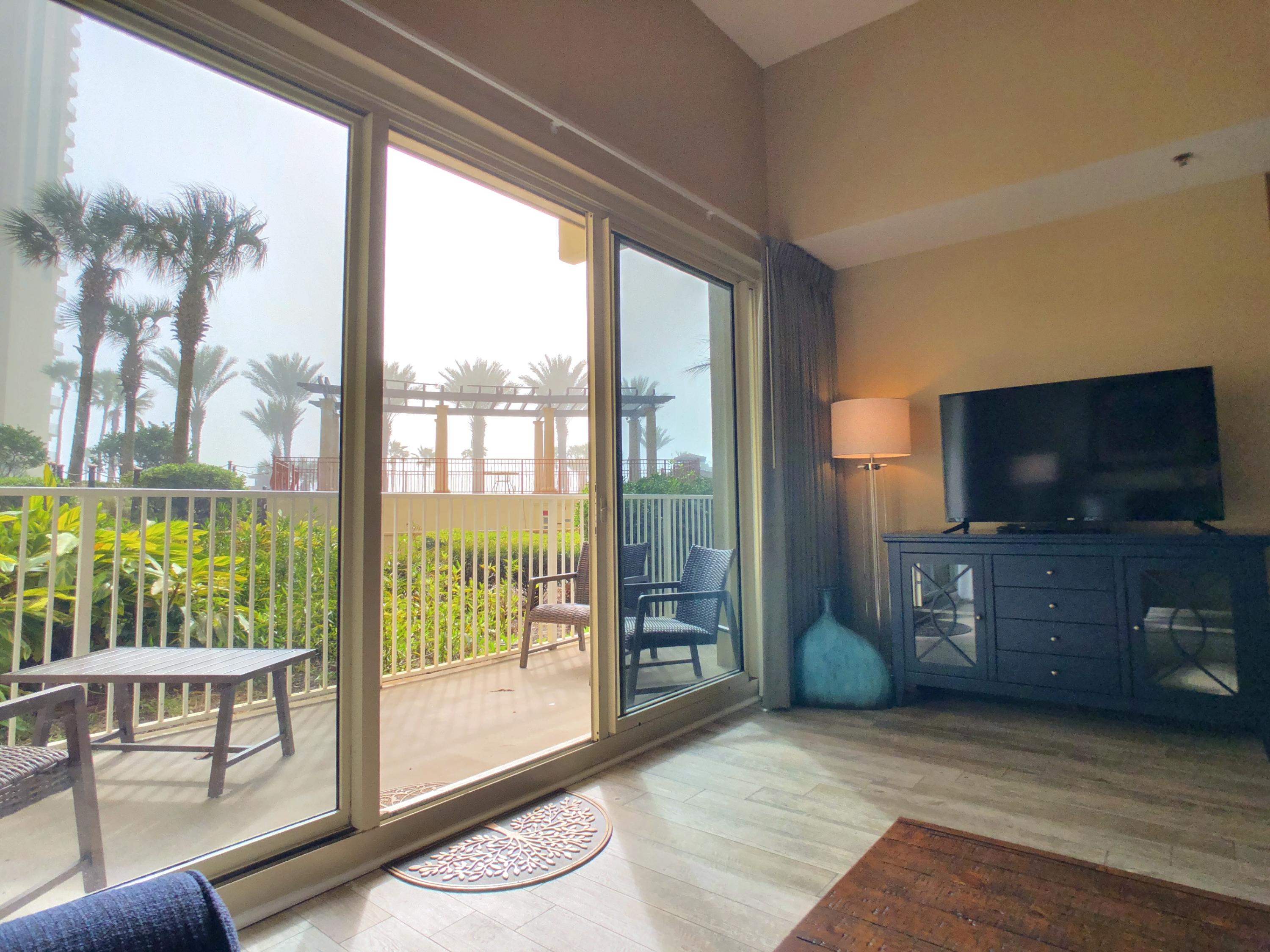 New HVAC Unit replaced March 2020 and has been significantly upgraded/ updated/ restocked Jan 2020. A RARE find, GULF- FRONT, CORNER unit CONDO on the FIRST FLOOR!! NO waiting for the ELEVATORS! The unit has an assigned parking spot. Currently on rental program,2019 rental income $33,778.43 and 2018 rental income $34,451.00 1 bedroom 2 bath with a bunk room. Granite counter tops. Patio overlooks beautiful tropical landscaped lagoon pool. Steps away from the sugar white beaches with a beautiful view of the emerald Gulf!Gated community with 2 outdoor pools a HUGE hot-tub, an indoor, heated pool with a spa, a sauna, two tiki bars and a 24 fitness center. On site check-in desk.