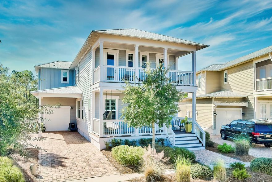 Residing on one of the most desirable homesites in the exclusive Naturewalk at Seagrove community, 22 Salamander Circle encompasses over 2,600 square feet of thoughtfully designed living space executed by the sought after building team at Kolter Homes. The spacious living area is appointed with coffered ceilings and hard wood floors which tastefully complement the elegant fireplace adorned with custom tile and stone accents. Discerning chefs will appreciate the kitchen with an oversized Carrera topped island, ample custom Shrock cabinetry, and a luxury appliance suite. The Master suite provides a true retreat overflowing with natural light, porch access, and a luxurious en suite featuring a soaking tub, tiled walk-in shower, and double vanities.