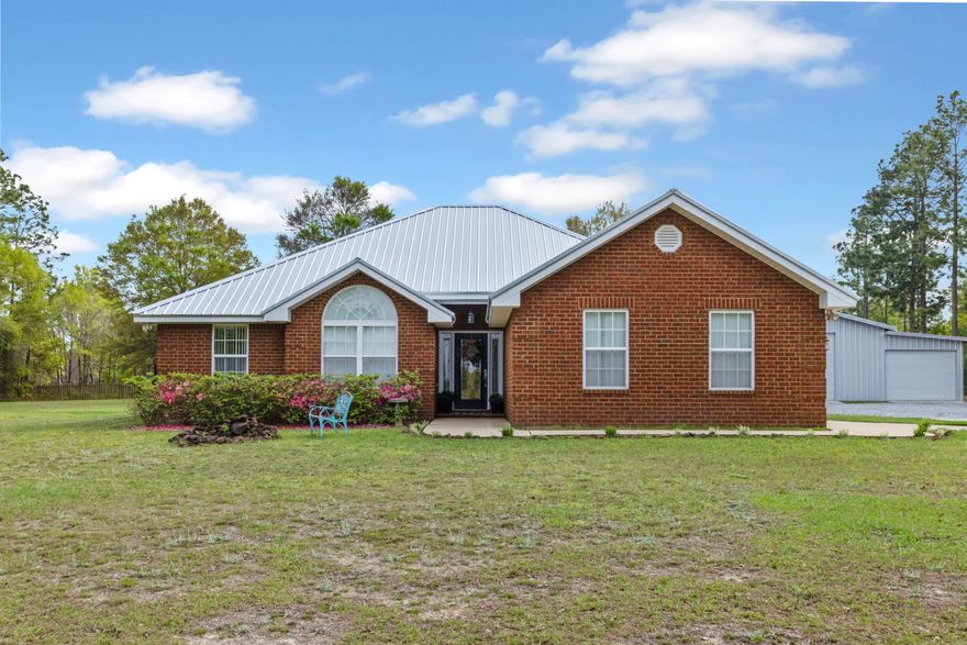 Come check out this very well maintained three bedroom, two bathroom brick home on 2 acres of land in the heart of Baker!! Brand new commercial grade roof installed October 2023, along with the covered back patio 20'x23' that was installed in the same time-frame! Located on the highly sought after Greenwood Road, where homes rarely come up for sale!! Beautiful tile all throughout the home, including newer LVP flooring in the spare bedrooms. Upon entering the kitchen you are greeted with all stainless steel appliances, including a new deep well, single bay sink, paired with beautiful wood cabinetry. A formal dining area is located to the right of the kitchen, the living area boasts 9ft tall ceilings with recess lighting all throughout for plenty of light, including two brand new ceiling fans. The master bedroom is very spacious, double closets in the master bathroom, including two sinks, and a separate shower. The home also offers an attached 2 car garage, ample driveway parking spaces and a large area for a basketball court as well. Located behind the home you will find a very large, maintained and de-weeded regularly, gravel path to the massive 36X64 three bay shop with commercial grade metal! The main center door is on an automatic remote control to open with a push of a button! The versatile shop offers a separate power service from the house with 220, along with plenty of outlets and lighting. Bring your buyers to view this absolutely beautiful home that's ready for its new owners and all their toys to store away out of the elements!