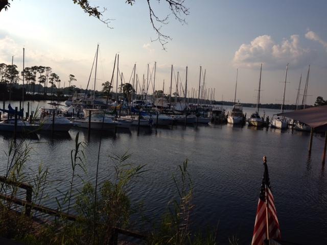 This end unit with waterviews is one of the finer 3 Bedroom Marina Cove Townhomes .. Owner has replaced living area flooring with light oak wood. Professionally decorated and furnished.Recent AC Unit, Dishwasher, Garage door opener, Tankless Water heater. Gas fireplace for cozy nights, balconies and screened porches for bringing the outdoors inside. Waterviews at breakfast nook and balcony off the nook, front bedrooms and loft. Walk to the marina and LJ Schooners or to the community Bayfront deck and dock. Bluewater Bay is a host to golf, tennis swimming, full service marina, and walking trails. The trails are free for use but fees are associated with the others. The Emerald Coast beaches, dining and shopping are just minutes away.