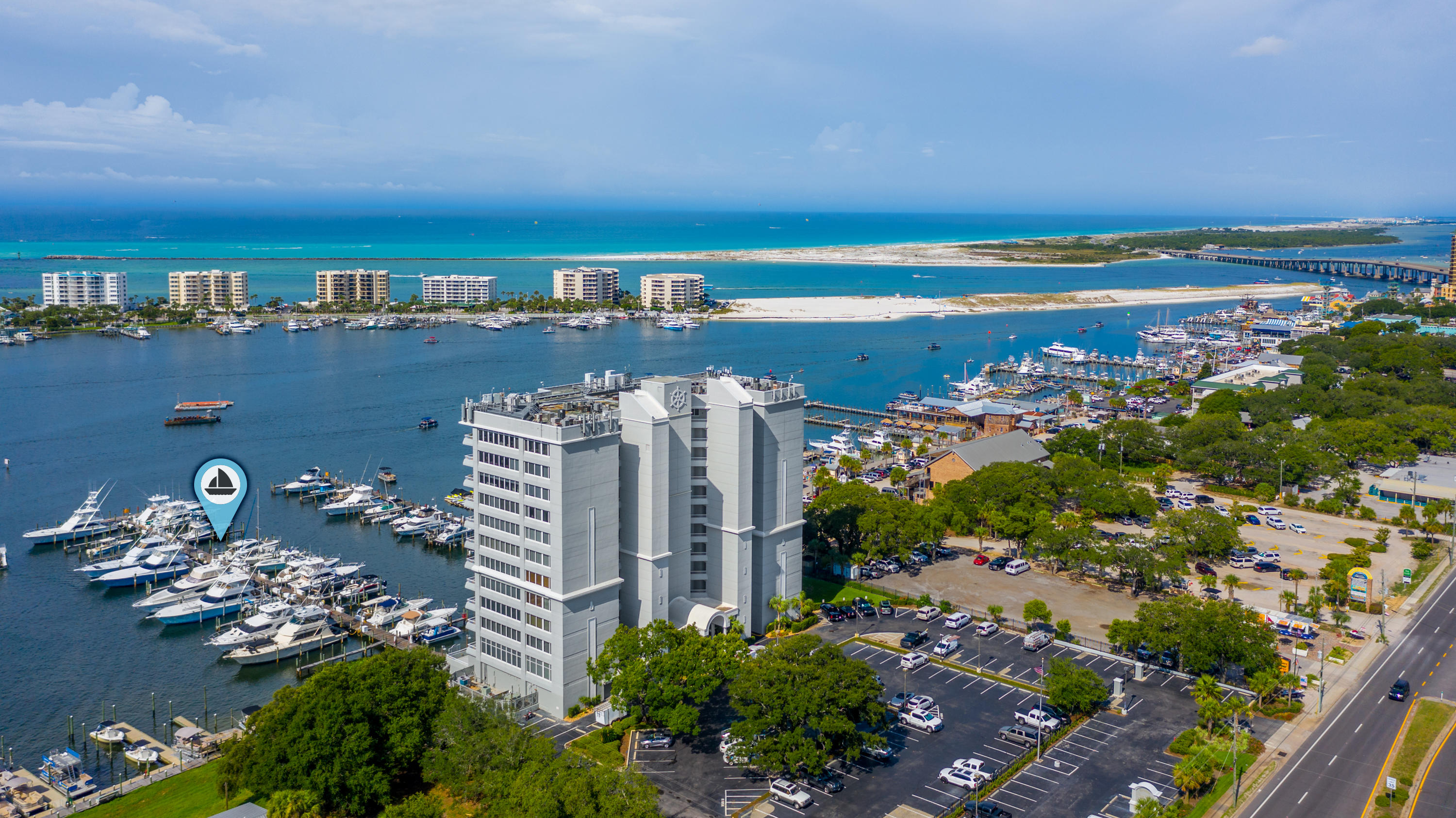 Gulf Pass view at the luckiest fishing village in the world! Enjoy the exquisite Destin Yacht Club, 11th floor unit with panoramic views of the Gulf, East Pass and the Harbor. Included in the price is Boat Slip #24=45 Ft! This unit features an open living area with bamboo flooring, power shades, granite counter tops complete with stainless steel appliances and custom cabinets. The balcony and master bedroom overlook the Harbor with Gulf views. The master suit has a spectacular bathroom with tile shower and spacious soaking tub! Three bedroom, three bath with a sauna!  This executive living has all the yachtsman's dreams and needs!  The protected waters of the Destin harbor gives you premium quick access to the Gulf pass, intracoastal waterway and Crab island. Destin Yacht Club offers