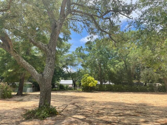 LOCATION, LOCATION, LOCATION! This beautiful lot boasts stunning oak trees and magnolias and is already cleared and ready for your dream home. Walking distance to nearby school and church, quiet street but still near everything you need! Your utilities are already ran saving you thousands!