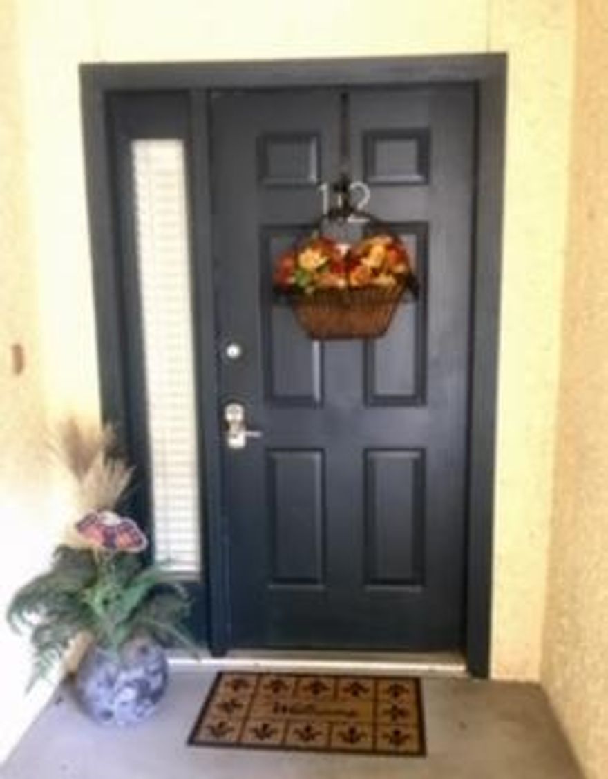 Beautiful ground level end unit in Bayside Villa. Best view of the sunset with panoramic view... three sets of doors open onto the covered rear porch overlooking the Bay. New wood flooring and recently updated. Open floor plan.