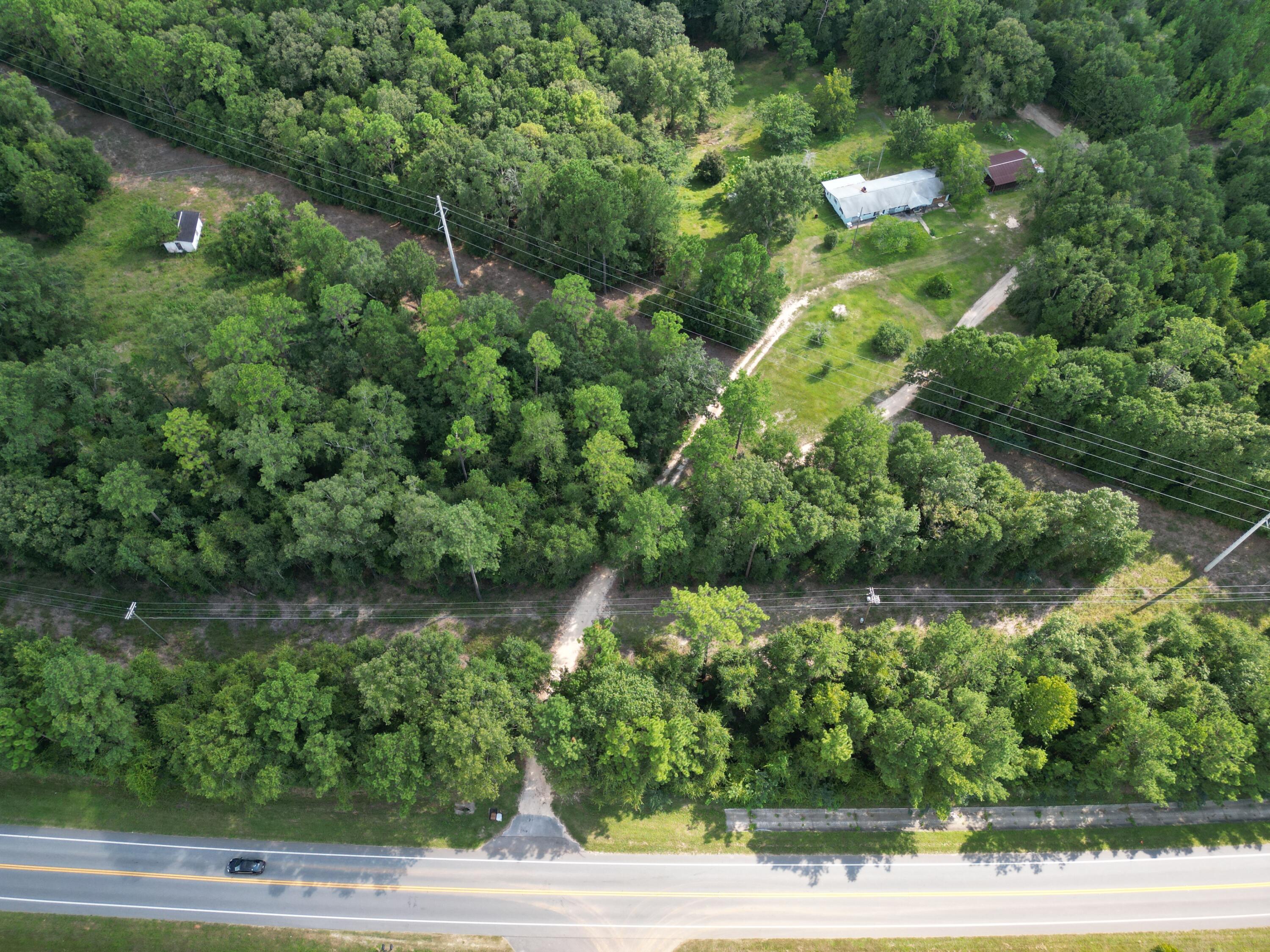 Welcome to your future 4 acre country home site! Property is partially cleared and wooded. Power and water are available. Property is about 5 mins from a public boat ramp on Escambia River. Enjoy fishing, horseback riding, camping, and all the fun outdoor activities just a short distance from your home. Paved road frontage on Hwy 4. Close proximity to schools, grocery stores, shopping, and eateries. Zoned AG-RR 1 dwelling per Acre can be divided into 3 parcels with a shared driveway. PER THE COUNTY : can get 4 parcels if they are split into 1 acre lot