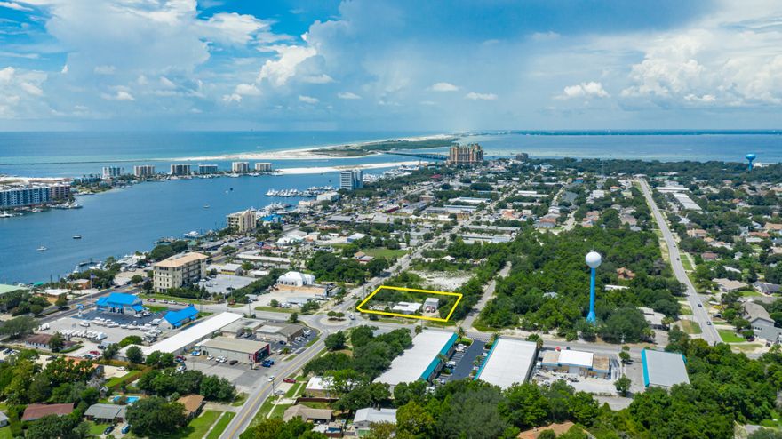 REDUCED - AMAZING LOCATION in downtown Destin!! Endless options possible on an incredible lot zoned for MIXED USE with 3 access sides. Great for your Business or Residence!! Property currently consists of two buildings; one single residence and an office over a two car garage. Perfect for a home business. Both buildings need lots of TLC and are As-Is. Less than a mile away from HWY 98, Destin Harbor, Joe's Bayou boat launch & Calhoun Park. Don't miss out on this great opportunity!!