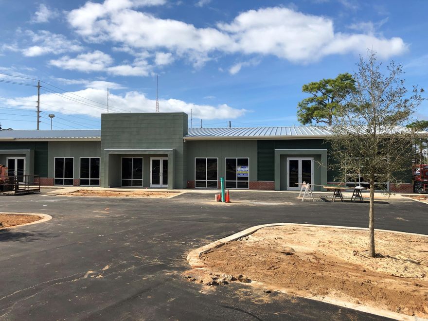 Brand new building with high ceilings and large storefronts great for office or retail. Roll up door on the north side and decorative roll up glass door on the front. High ceilings with stained concrete floor. Possible tenant improvement allowance for 5 year lease. Led lighting and single bathroom for 2000 tenant and two bathrooms for 4,000 space.