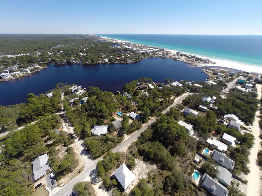 Owning a second row Lot from the Eastern Lake is extraordinary because of the close access to the Eastern Lake Inlet and public walk-over to the Gulf. No HOA fees nor buildout time in this iconic beach neighborhood. This Lot is located only nineteen Lots north of the Gulf of Mexico. Enjoy the Eastern Lake with canoes, paddle boarding, kayaks, boating, water skiing and the Eastern Lake public boat launch across the Eastern Lake bridge off Lakewood Dr. Most of the owners in this neighborhood own second homes, primary, or rental properties. Ice Cream trucks come around the block during the summer, all the kids ride bicycles down to the beach and friendly neighbors walk. Build anytime according to Walton County Building Codes, which allows 50 ft. heights, which may create great views!