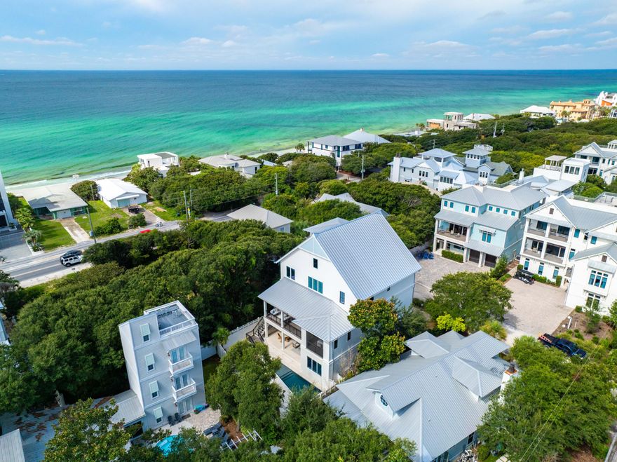 Perfectly positioned in the sought-after Old Seagrove community, 32 Camellia is a stunning coastal estate offering 6,645 square feet of beautifully designed living space. With panoramic Gulf views from multiple levels, this eight-bedroom, nine-bathroom home was thoughtfully crafted for multi-generational living, seamless entertaining, and luxurious comfort.The first floor welcomes you with a spacious entertainment lounge, two guest bedrooms, and direct access to a private backyard oasis--complete with a sparkling pool, relaxing spa, and a fully equipped summer kitchen ideal for hosting gatherings year-round.Upstairs, the second level features an expansive open-concept kitchen, dining, and living area that flows effortlessly onto a covered porch overlooking the pool.  A serene primary suite completes this level, offering privacy and elegance. The third floor boasts an additional living space, three ensuite bedrooms, and two oversized bunk roomsperfect for extended family or guests.

Crowning the home is a top-level rooftop deck and covered viewing porch that captures breathtaking, unobstructed Gulf viewsan idyllic setting for sunsets, morning coffee, or evening cocktails.

Designed for effortless indoor-outdoor living, multiple porches and gathering spaces create the ultimate coastal retreat. High-end finishes, designer lighting, and carefully curated interiors bring a refined, yet relaxed sophistication to every room.

Located just steps from the sugar-white sands via the nearby Gardenia Street beach access, and within easy walking distance to the vibrant shops and dining of Seaside and WaterColor, this home offers both tranquility and convenience.

Whether you're looking for a luxury second home, a full-time residence, or a high-performing vacation rental, 32 Camellia delivers exceptional potential and an unparalleled 30A lifestyle.

Inquire today and make your dream of coastal living a reality.