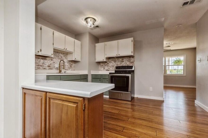 Updated 3BR/2BA Home in the Heart of Fort Walton Beach! Fresh paint!  This turnkey ranch home offers major system upgrades & modern finishes throughout. Enjoy peace of mind with a New Roof (2022), New exterior HVAC compressor (2023), Updated Electrical Panel & a New Tankless Gas Water Heater! Inside, the home features new hardwood flooring, a remodeled master bath with a custom stall shower & an updated guest bathroom--giving you 2 full baths with a clean, contemporary feel. Step outside to a covered lanai & a fenced backyard with a storage shed. Bonus features include hurricane shutters, ceiling fans & a garage with rustic ship-lap walls for added character.