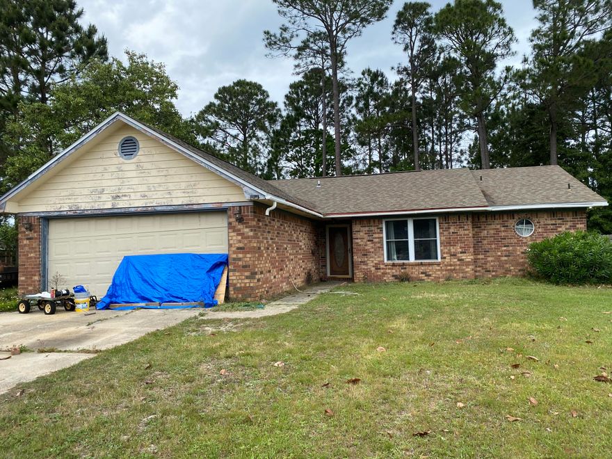 Roll up your sleeves and bring your tools. This home is almost there. Conveniently located in the wildly popular Navarre area, this property is just a few mins driving to hwy 87, Navarre Beach, Shopping and Hurlbert. A definite must see to appreciate the potential here. Level lot, cul-de-sac location, and larger lot are just a few things that make this home attractive. Will not qualify for financing due to repairs needed.