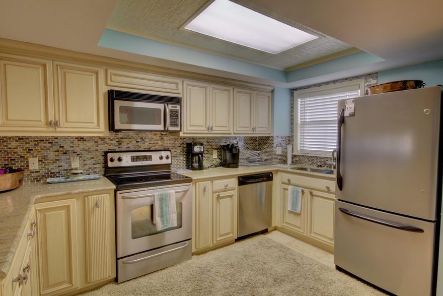 If you have been waiting for a piece of Paradise wait no longer. This Beautiful 2 Bedroom 2 Bath ground floor Unit is just what you have been waiting for. You will see the attention to detail as soon as you walk in the door. The kitchen has Custom Cabinets with detailed hardware to add a touch of elegance. Graanite counter tops with a glass back splash that add such a flair and multiple pops of color. Broom closet off the entry way. You will find so many elegant touches through out. From the recessed lighting in the entry way to the wide crown molding through out. Each bath has custom cabinets. with tub/shower combo that have glass surround that just add the flair of style.Owner/linen closet in hallway. Breakfast bar.In the dinning area you will find a mirrored accented setback that