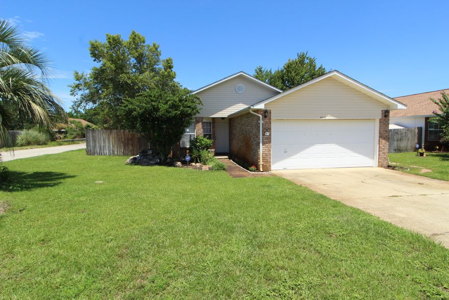 MOVE-IN READY! Nice family home situated on a large corner lot in Parker Place neighborhood. Spacious living with vaulted ceiling, designer lighting and bamboo flooring throughout. Dining area opens into the living room offering you plenty of room to entertain. Light and bright kitchen with center island, breakfast bar, pantry and a breakfast nook inside a bay window. Master bedroom has a private bath with double vanities and a walk-in closet. Split bedroom floor plan allows privacy from children and guests. Two additional bedrooms and a full bath complete this perfect package. Inside laundry room. The backyard is fully fenced and there is a large deck with an arbor perfect for cookouts and parties or just relaxing. Storage shed, lawn pump and sprinkler system. Close to shopping