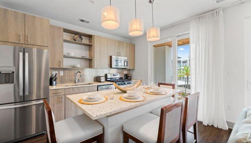 Welcome to Unit 335 at The Pointe on 30A! Discover coastal living at its finest in this spacious condo perfectly situated next to Rosemary Beach. Located on the east end of 30A, this charming residence offers unparalleled walkability to boutique shops, gourmet dining, and pristine beaches. Enjoy a bright, open-concept living space with large sliding glass doors showcasing pool-side views. The kitchen features stainless steel appliances with a gas range and quartz countertops. This beautifully appointed 2-bedroom, 2-bathroom unit also features high-end built-in bunk beds ideal for peak performance as a vacation rental. The expansive pool-side deck is ideal for savoring morning coffee or sunset cocktails while soaking in the gulf breezes. The Pointe on 30A features a resort-style pool with cabanas and hot tub as well as a rooftop terrace with Gulf views. The development offers a modern fitness center and on-site restaurant. Embrace the 30A lifestyle in this rare gem, where luxury, location and walkability converge.