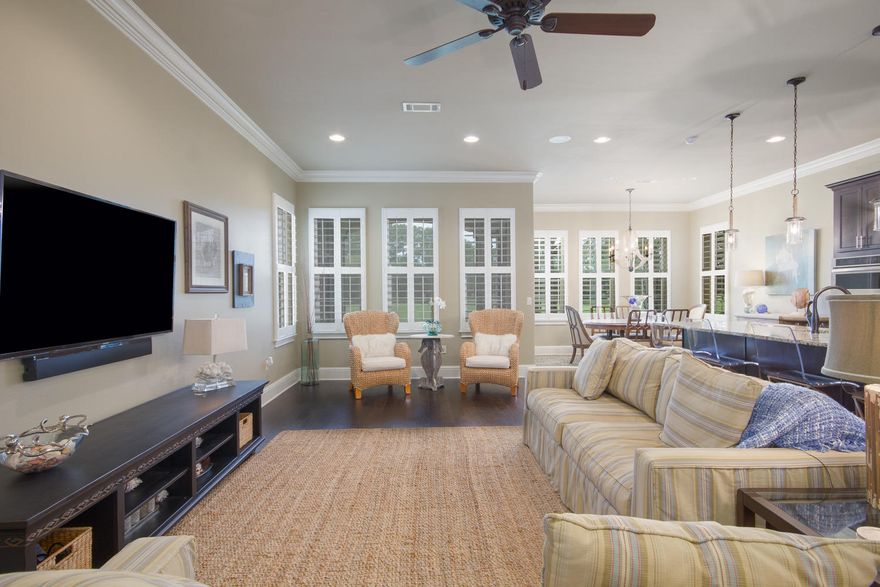 Love to entertain? This home is just for you with its modern, sleek kitchen that is open to the oversized great room and dining area. Plenty of living space to host a family gathering. This newer, Mediterranean-style home is nestled along the 5th fairway of Baytowne Golf Course towards the end of a dead end street. The back porch has been screened in for a comfortable sitting area to enjoy serene views of the lake and greens. The interior is warm and inviting with features like hardwood flooring throughout, crown molding, plantation shutters, and raised ceilings. In addition, this home features a single car garage and a master retreat complete with a huge walk-in closet, en-suite bath, and private balcony overlooking the golf course. Villa Lago offers a private community pool & clubhouse.