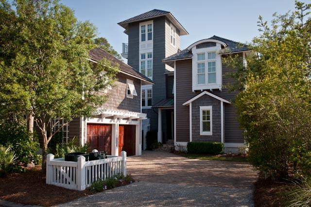 284 Yacht Pond was designed by renowned Tom Christ Architects. The 5 bedroom, 5 bath home boasts unparalleled views of the Gulf just beyond the untouched sand dunes of Watersound. The perfectly private lot lines the conservation area of Watersound Beach and will always remain preserved. The interior features two master suites, reclaimed hardwood floors throughout, old Chicago brick floors and fireplace, Italian tile in the laundry and carriage house, elaborate wood detailing, a custom metal stair handrail and fireplace, and rustic barn doors in the master suite; these details give the house lots of character. The exterior of the house was not spared when the property was designed to perfection. There are gorgeous Bevolo copper lanterns, extensive landscaping, irrigation, and exterior