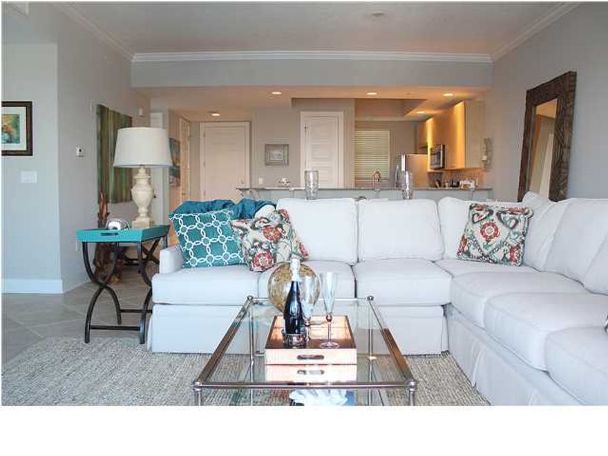 **These are interior photos of previous model unit 515 but 513 is the same exact floor plan** INVESTOR CLOSEOUT SALE!!! Do not miss out on this incredible opportunity to own in Harbor Lights, a beautiful, prominent 7-story condominium nestled on the Destin Harbor with luxurious amenities and views. This 2BR/2BA unit comes with a 1-car garage #15 and climate controlled storage room #15. Boat slips are also available at an additional charge. Interior is currently being renovated and will have new porcelain tile floors in the entry, kitchen, & living area, new carpet in the bedrooms, fresh paint, new stainless steel appliances, and a custom backsplash in the kitchen. Other interior features include raised ceilings, granite countertops & breakfast bar, crown molding, and an open floor plan.