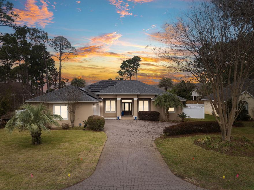 Welcome to your new home! This stunning 4-bedroom, 2-bathroom custom-built home offers the perfect blend of comfort, efficiency, and style. Nestled on a quarter-acre lot, just a block away from the bay, in a non-flood 'X' zone, this property is designed for effortless living and entertaining. From the moment you arrive, the newly paved driveway, and expansive garage provides ample parking for both you and your guests. Step inside this beautifully designed home and experience the perfect balance of space and elegance. The raised 13-foot vaulted ceilings create an open and airy atmosphere, allowing natural light to fill the home. The expansive living area offers plenty of room for relaxation and entertaining, seamlessly flowing into the kitchen and dining spaces. The gourmet kitchen features modern appliances, ample counter space, and custom cabinetry, making it both functional and stylish. The primary suite is a true retreat, with large windows, private access to the porch, and a spa-like ensuite bathroom. The additional three bedrooms provide comfort and flexibility, perfect for guests, family, or even a home office. Throughout the home, you'll find thoughtful design elements, from elegant flooring to custom built-ins, and high-end finishes, ensuring both beauty and practicality. Whether you're hosting gatherings or enjoying a quiet night in, this home's open-layout and impressive ceiling heights create a warm and inviting space you'll love coming home to. The focal point of the home is the backyard oasis, with a heated/cooled pool allowing for year-round enjoyment. The spacious screened-in back porch overlooks the beautifully newly landscaped, fully fenced yard, complete with low-maintenance newly installed astroturf for a pristine look without the hassle of having to ever water the grass. One of the home's notable features is its fully paid-off solar panels, which power the housemeaning, no electric bill! This home is truly a rare find. Newly installed LVP flooring, and carpet. The home was also recently painted on the inside and outside. In a non-HOA area. Located just 5-minutes to the nearest beach access, in the middle of Miramar Beach, close-by restaurants, grocery stores, shopping and entertainment. Don't miss outschedule your private tour today!