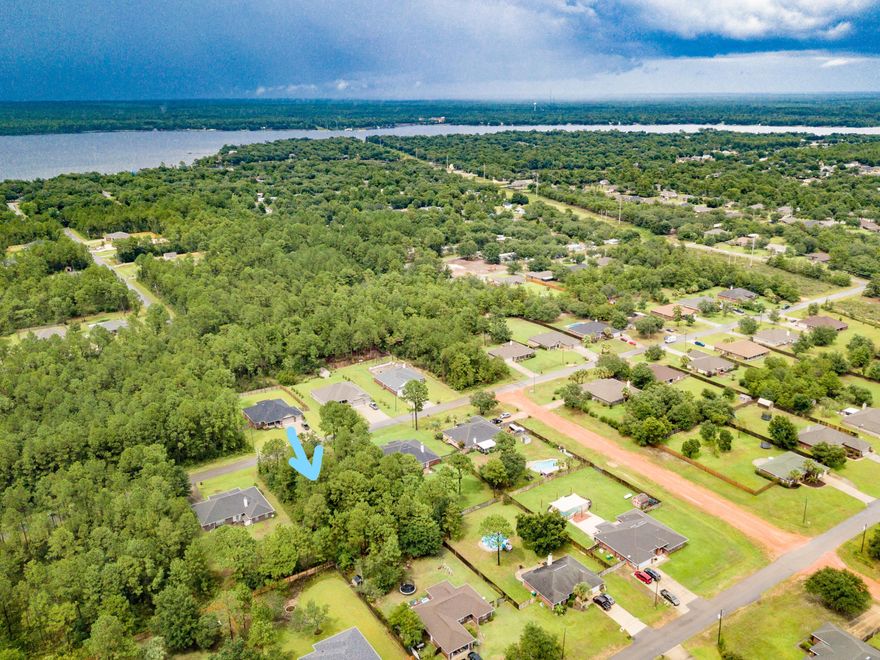 Come build your new home on this High & Dry Half acre lot in Holley By The Sea. Wetlands Study available Ownership includes membership to Holley by the Sea's multi-million dollar 45 acre recreational center with 8 clay tennis courts, 3 swimming pools, full gym, aerobics, summer camp, lighted basketball courts, sauna & steam room, playground game room, community house on Santa Rosa Sound with playground, dock, access to the East Bay boat launch and many community events. Only minutes to the beautiful beaches of Navarre with sugar white sand and emerald green waters.