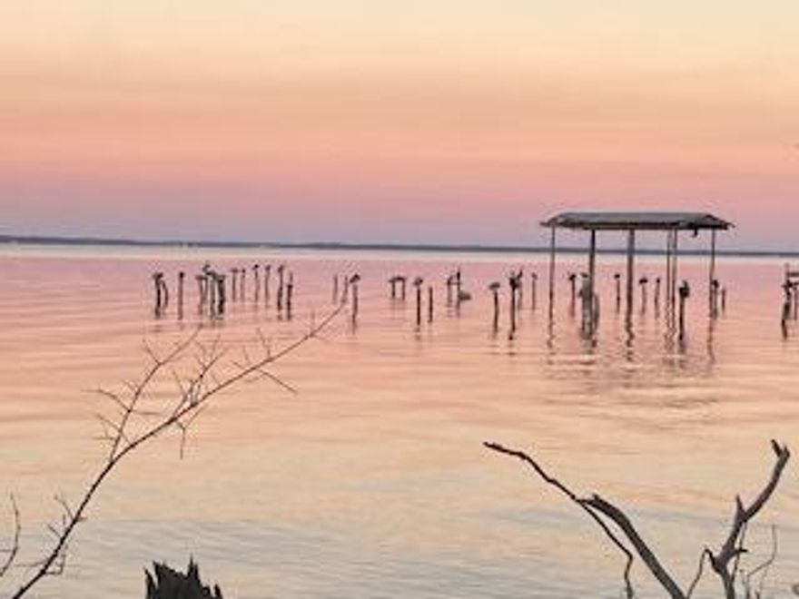 Bayfront Lot in Santa Rosa Beach, Florida. The work needed to be done to this lot to be ready to build has almost been completed. Wetlands on the front of property will not deter from building on the bayside lot. The wetlands have already been mitigated and paid for. Culvert has been placed and dirt driveway has been cleared. House footprint has also been cleared. All permits for driveway have been paid for as well. This includes Army Corps of Engineers and Florida Department of Environmental Protection. Survey, lot topographical and elevation certificate have all been completed. Seller also has plans for house currently approved by Walton Co Planning Dept.