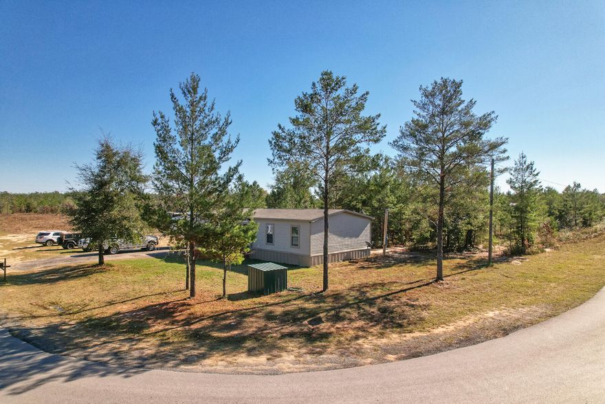 BACK ON THE MARKET, due to no fault of the seller!! Appraised at asking price. Beautiful Grande 4Bdr/2bath, 1,404 sqft Mobile home on .39 acre cleared corner lot centrally located near the Mossyhead area just minutes from easy access to I-10 between Crestview and DeFuniak Springs. As you walk into the front the door, you are greeted with a large open living/kitchen area. Kitchen is full of amazing cabinetry surrounding the whole kitchen on all sides. Gather your family and friends around the huge center island for dinners and entertainment.  This island has a very cool feature that holds (2) 23 cu. Ft. freezer under the countertop. The split-bedroom floorplan offers a spacious master bedroom at one complete with a very roomy master bathroom complete with oversized walk-in tile shower and walk-in closet. The other end of the home offers (3) good size bedrooms. Home has a nice size deck out front to relax and enjoy your morning coffee, etc.  Bring your animals to enjoy the spacious yard with lots of room to roam.

Kitchen has a water filtration system. The both freezers and Washer/Dryer do not convey.  Already been removed.

Buyer needs to verify building codes and/or zoning regulations with proper local authorities to ensure buyer will be able to utilize the property for intended use.  Information contained within this listing such as square footage, etc is deemed to be accurate but is not guaranteed. 