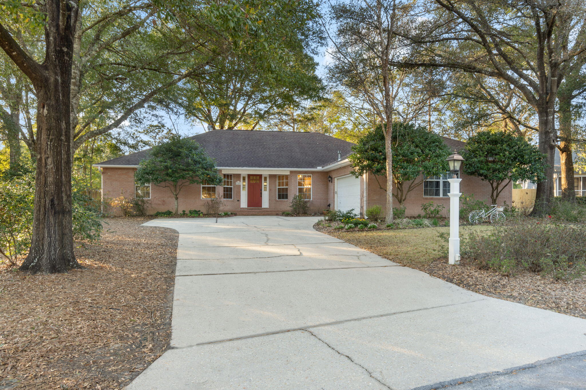 $5K Buyer closing credit. Custom home south of I-10: features 4 beds, 2.5 baths, renovated Kitchen (stainless appliances & concrete countertops) Laundry area with custom cabinetry & organizers (which is not only stunning but highly functional). Home features hardwood flooring in main areas, plenty of natural lighting & gas fireplace. Master bath has a spa area with walk in shower & soaking tub & large walk in closet. This home is made for hosting gatherings with a large 3 panel sliding door to the extra large screened in porch and multiple levels of composite made decking in the shaded backyard. Fully fenced backyard. Lawn & gardens are a standout feature with year round beauty & feature irrigation for both the front and back lawn areas. Buyer to verify all deemed important informati