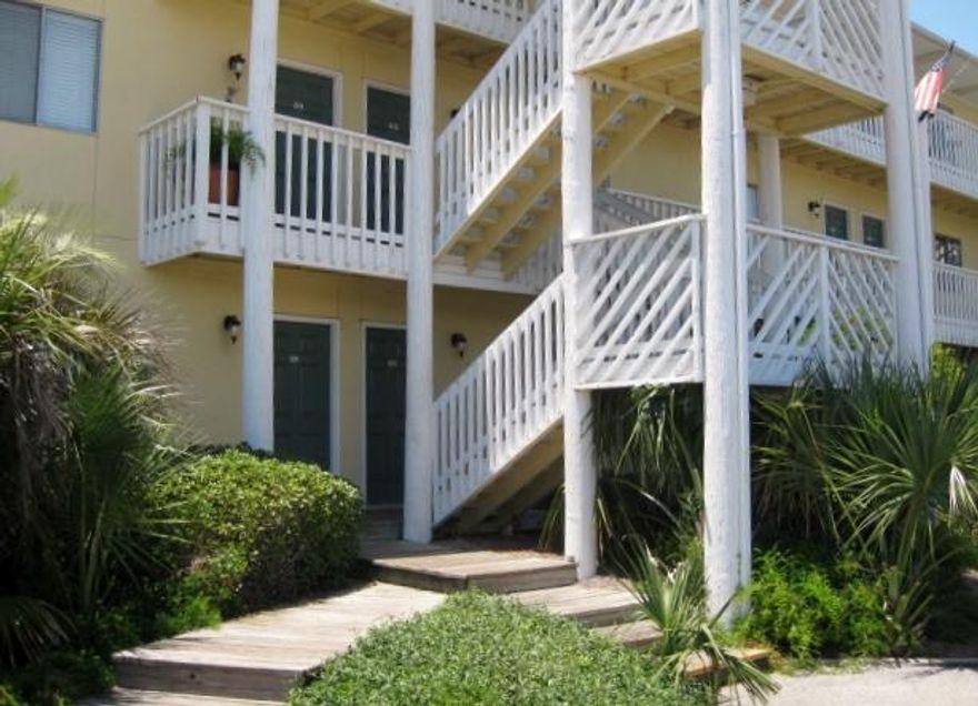 Great opportunity to live on Holiday Isle for under 100K! This one bedroom condo is just waiting for you to put some lipstick and blush on it. No hauling groceries up the steps - you're on the ground floor!! Just a short walk from the beach and you're home! Buyer to verify all measurements.