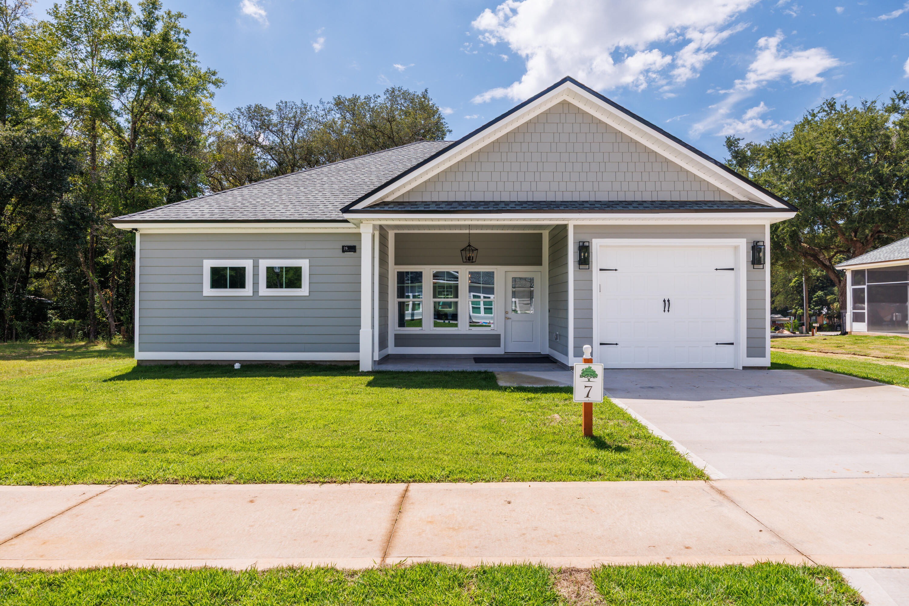 Offering $10,000 Flex Money!!!Welcome to the custom built Magnolia Cottage, a beautifully designed, custom-built 2 Bedroom/2 Bathroom home with a garage, located in the tranquil and growing community of Live Oak Cottages in Freeport, Florida. This stunning 1,279 sqft residence offers a perfect blend of modern luxury, energy efficiency, and stylish finishes, making it an ideal place to call home.Key Features:Durable Construction & Premium MaterialsBuilt on a solid 3000 PSI concrete slab with a 7/12 roof pitch, this home ensures both long-lasting durability and superior weather resistance. The exterior is finished with low-maintenance Cementous Hardie Board siding, complemented by Polygene fiberglass-insulated windows and doors to enhance energy Modern & Efficient Interior- Inside, the home offers 10-foot ceilings that create a bright and open atmosphere. The open-concept floor plan seamlessly connects the kitchen, living, and dining areas, making it perfect for both entertaining and everyday living. Luxury Vinyl Plank (LVP) flooring runs throughout, while custom cabinetry, a gourmet kitchen with quartz countertops, and stainless-steel appliances bring both style and functionality.
Spacious Bedrooms & Luxurious Bathrooms- The primary suite features a luxurious en-suite bathroom with a double vanity, quartz countertops, and a roll-in tiled shower for ultimate relaxation. The second bathroom offers a deep soak tub with a tiled shower combination, making it perfect for unwinding after a long day.
Outdoor Living at Its Best- Enjoy the 12x10 tiled and screened back porch, ideal for year-round relaxation. The fenced backyard offers privacy and security, while two exterior water faucets provide added convenience for outdoor chores or gardening.
Energy-Efficient SystemsThis home is equipped with a 2-ton, 15 SEER HVAC system with a programmable thermostat for optimal comfort year-round, as well as a 40-gallon hot water heater to meet all your utility needs.
Prime Location- Live Oak Cottages is ideally situated in Freeport, FL, offering a quiet, serene setting while being just minutes from vibrant local shopping, dining, and schools. You're also less than 25 minutes from the beautiful beaches of 30A and the stunning Emerald Coast.
Don't miss this opportunity to own a thoughtfully designed, energy-efficient home in one of Freeport's most desirable communities. Schedule your private showing today!